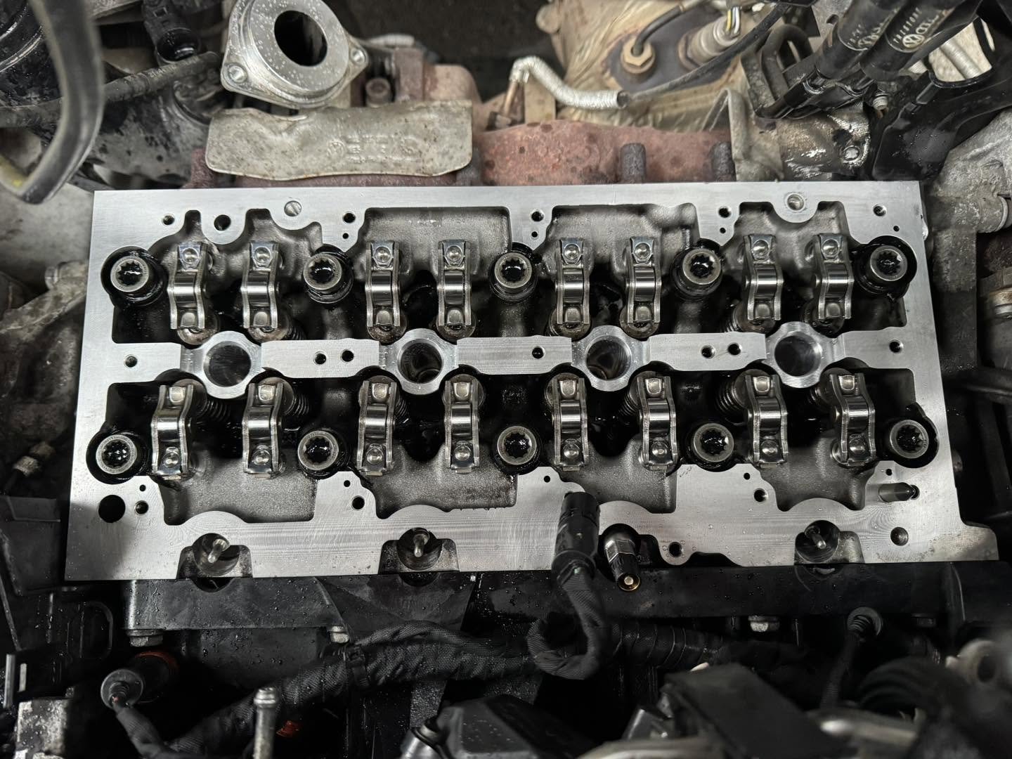 Cleaned aluminium engine oil sump on the workbench after professional service